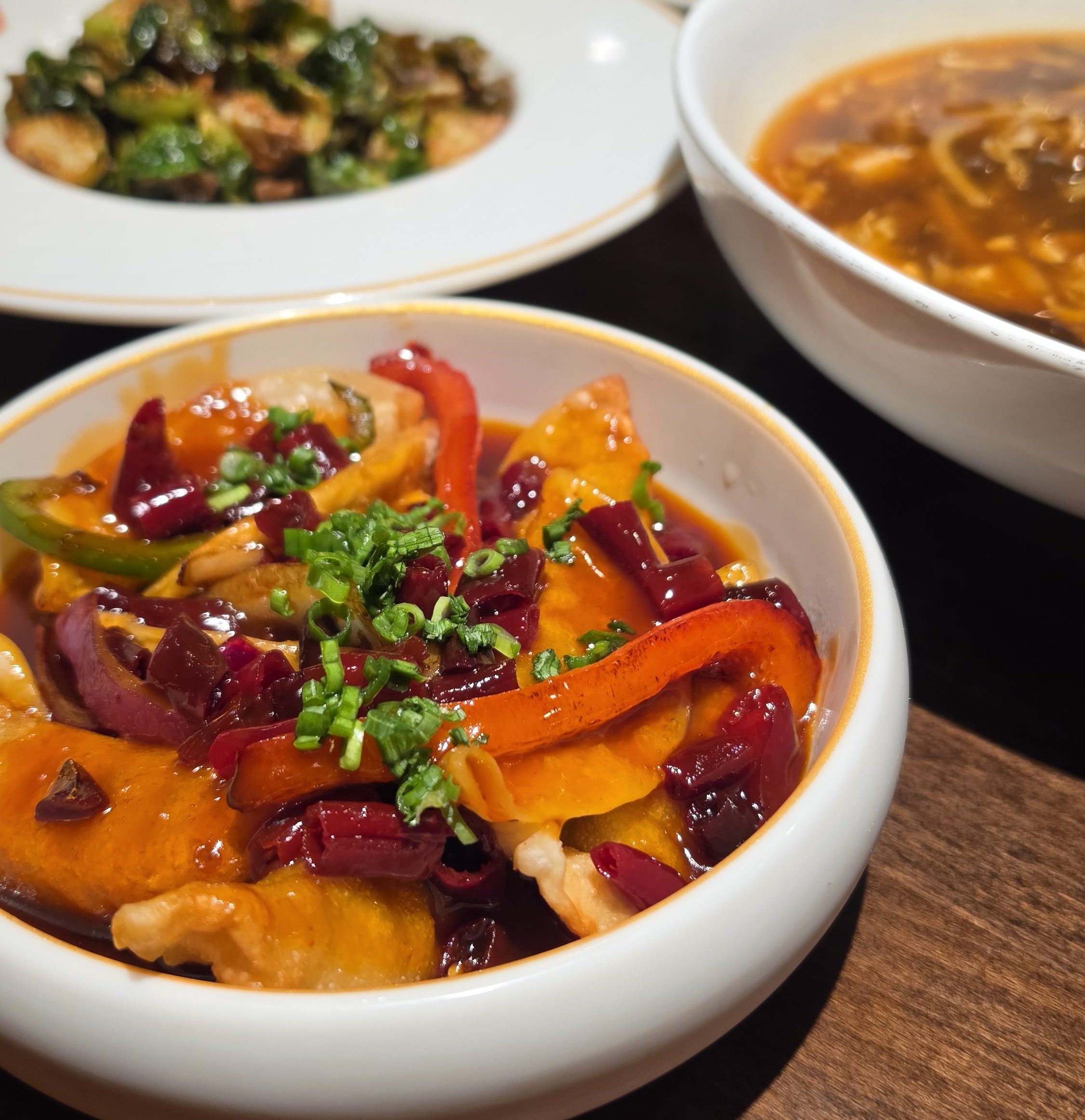A colorful spread of international dishes prepared for an Acadiana tasting tour